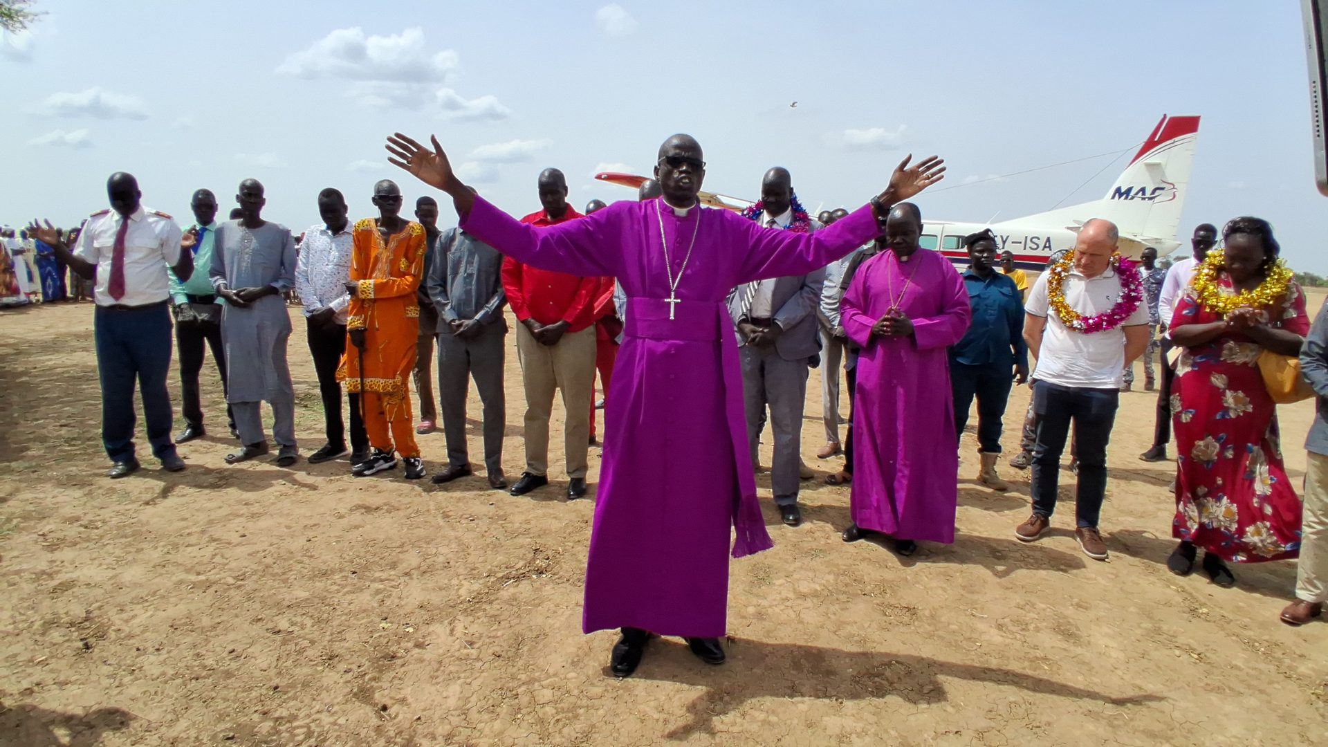 Bishop Joseph Mamer blessing a gathered crowd